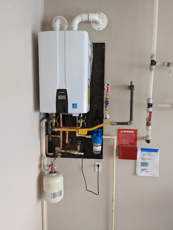 Professional plumber installing copper piping in a Hazlehurst home